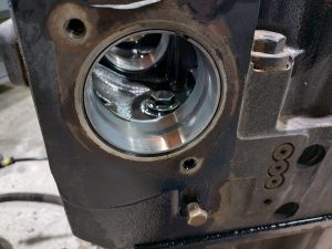 “Cummins ISX engine cam bearing showing excessive wear during teardown”