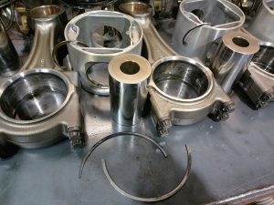 “Broken piston rings on a Cummins ISX engine during teardown showing internal engine damage”